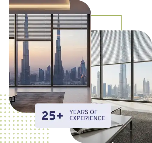 A modern, high-rise office or apartment interior with large floor-to-ceiling windows showing a panoramic view of the Dubai skyline, including the Burj Khalifa.